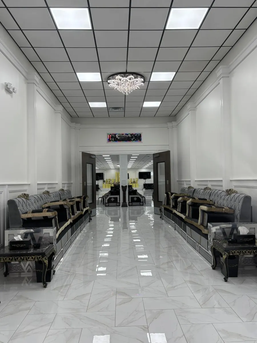 Long white lounge with traditional seating along both walls
